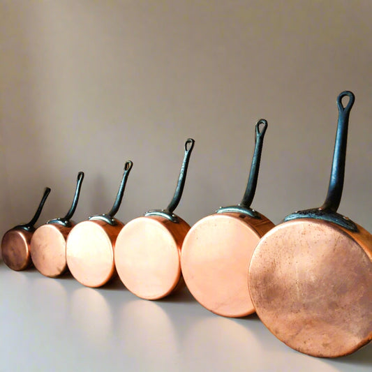 SIX Copper Pans with Cast Iron Handles from Tiggy & Pip - Just €280! Shop now at Tiggy and Pip